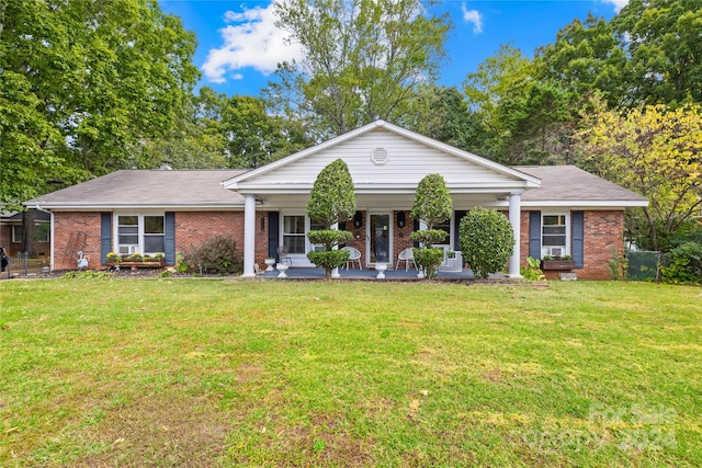 view of front facade with a front yard and a porch