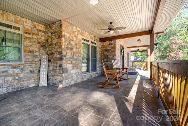 view of patio featuring ceiling fan