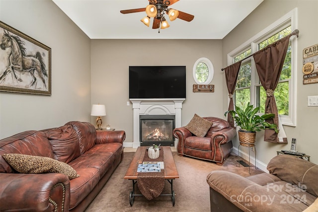 living room with ceiling fan and carpet floors