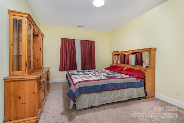 bedroom with light colored carpet