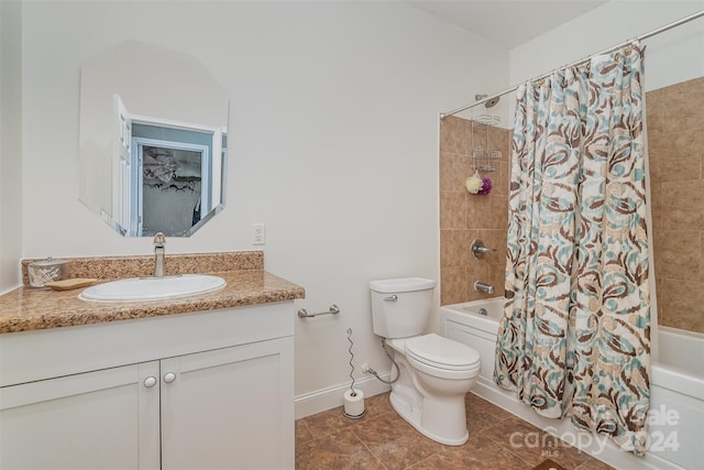 full bathroom with vanity, shower / tub combo with curtain, toilet, and tile patterned floors