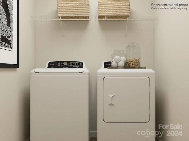 clothes washing area featuring independent washer and dryer