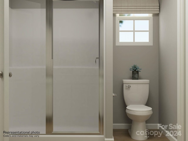 bathroom with an enclosed shower, toilet, and wood-type flooring