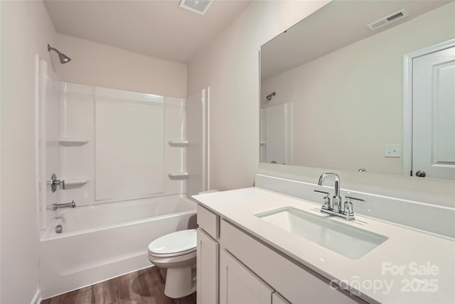 full bathroom with visible vents, shower / bathtub combination, wood finished floors, and toilet