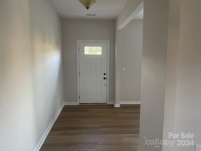 doorway to outside with dark hardwood / wood-style flooring