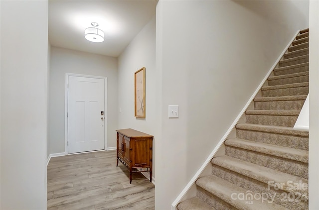 entryway with light hardwood / wood-style floors