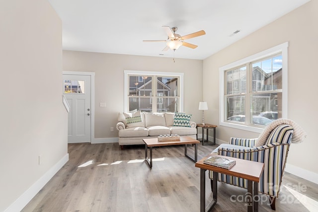 living room with hardwood / wood-style flooring and ceiling fan