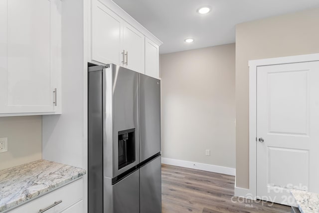 30 Wheeler Rd, Weaverville, NC 28787 - kitchen with stainless steel fridge with ice dispenser, wood finished floors, white cabinetry, baseboards, and light stone counters