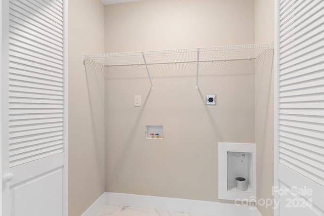 clothes washing area with washer hookup and electric dryer hookup