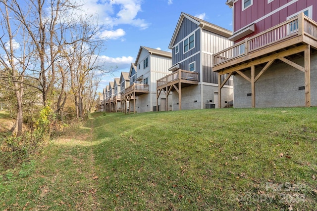 30 Wheeler Rd, Weaverville, NC 28787 - rear view of property featuring board and batten siding, a yard, a deck, and central air condition unit