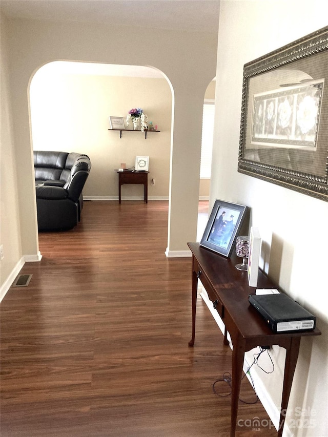 hall with dark hardwood / wood-style floors