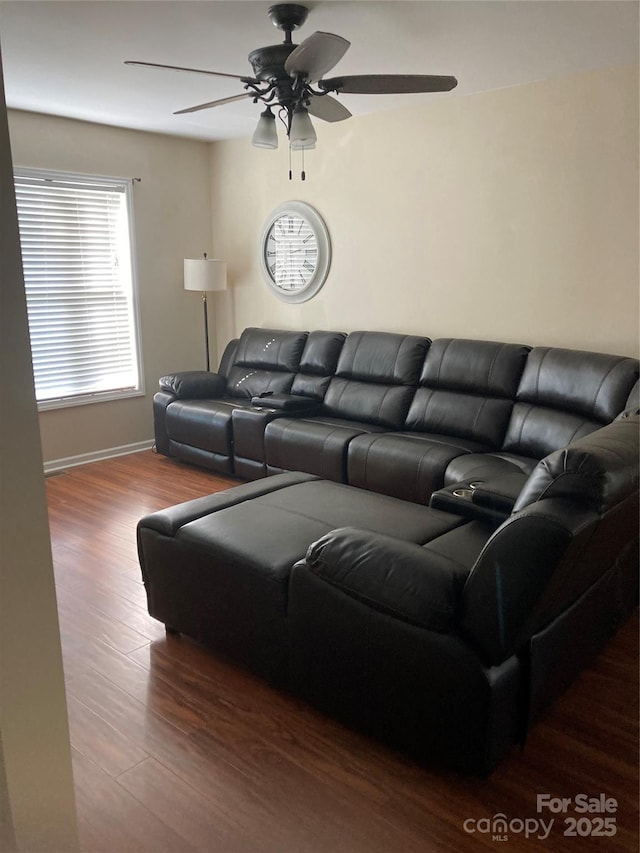 living room with hardwood / wood-style flooring and ceiling fan