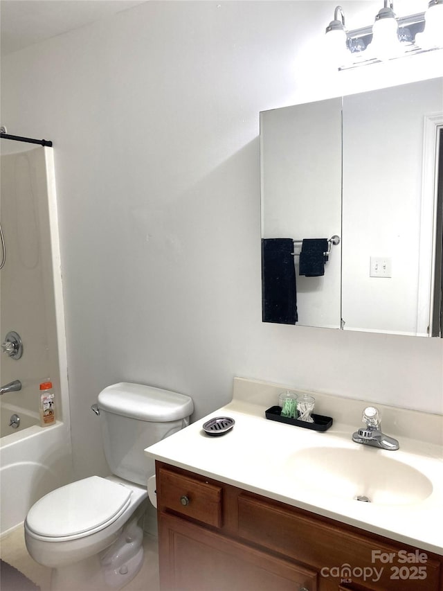 full bathroom with shower / bathing tub combination, vanity, and toilet