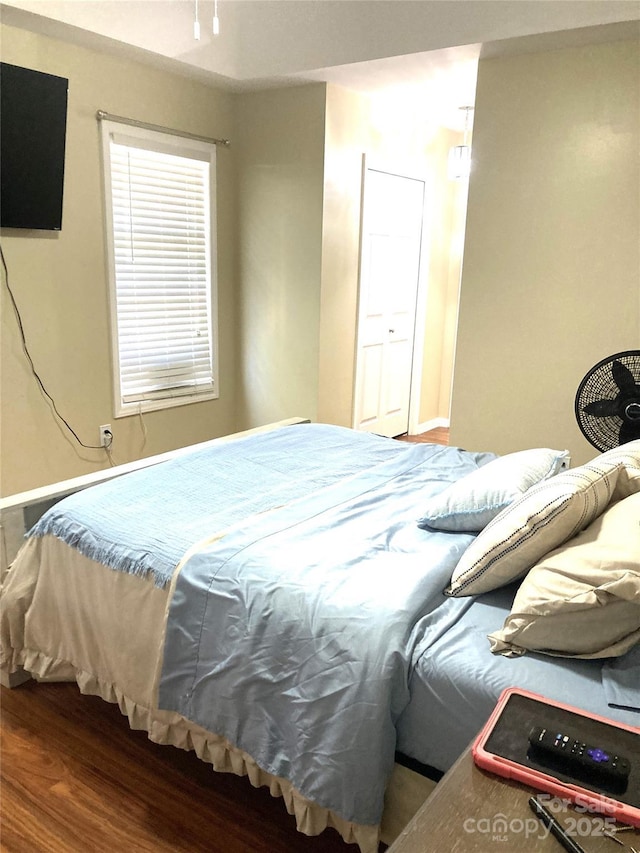 bedroom with hardwood / wood-style floors