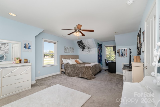 bedroom featuring ceiling fan and light colored carpet