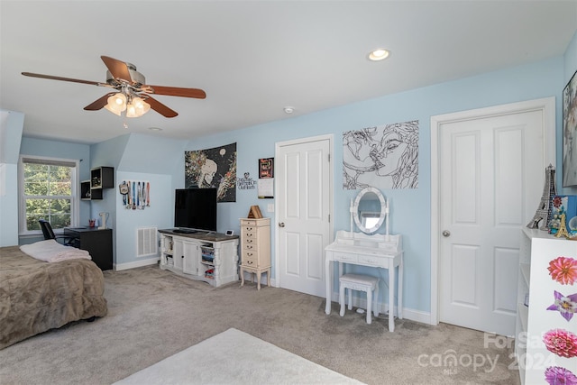 bedroom with light carpet and ceiling fan