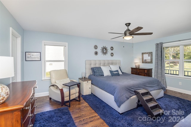 bedroom featuring ceiling fan and dark hardwood / wood-style flooring