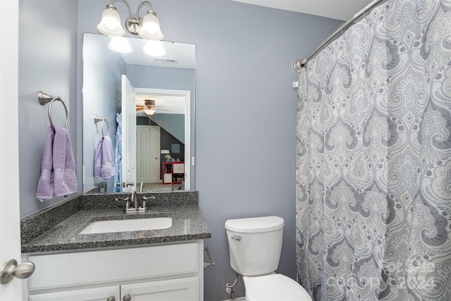 bathroom with ceiling fan, vanity, and toilet