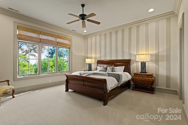 bedroom with ornamental molding, carpet flooring, and ceiling fan