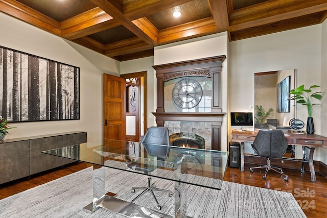 office with coffered ceiling, beamed ceiling, a fireplace, and dark wood-type flooring