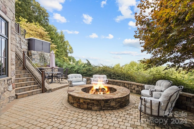 view of patio with an outdoor fire pit