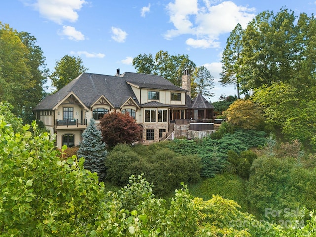 back of house with a balcony