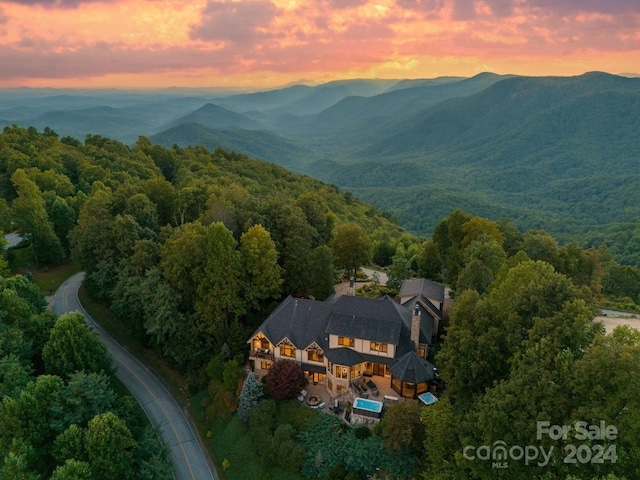 aerial view at dusk with a mountain view