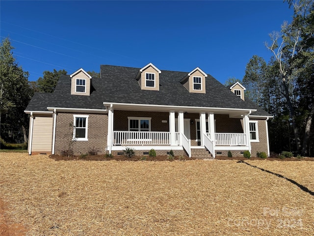 cape cod house with a porch