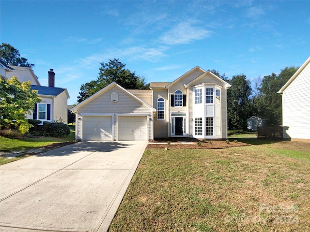 front of property featuring a garage and a front lawn