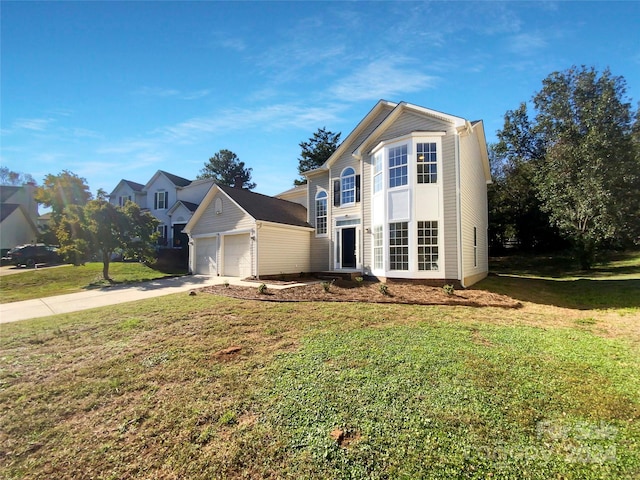 front of property with a front lawn and a garage