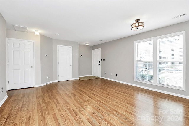 unfurnished room featuring light hardwood / wood-style flooring