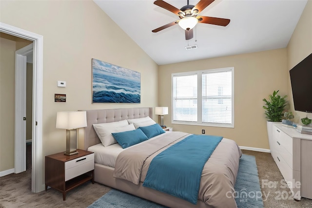 bedroom featuring dark colored carpet, ceiling fan, and lofted ceiling