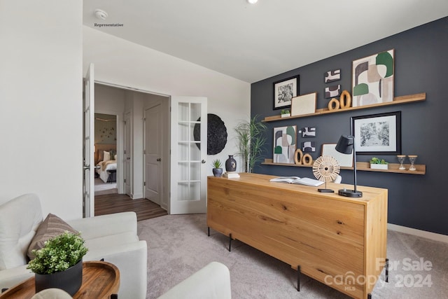 interior space featuring light wood-type flooring and vaulted ceiling