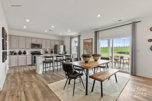 dining area with light hardwood / wood-style floors