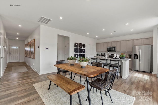 dining area featuring light hardwood / wood-style flooring