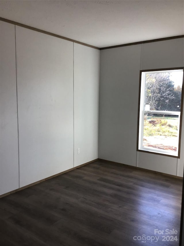 spare room featuring dark hardwood / wood-style floors