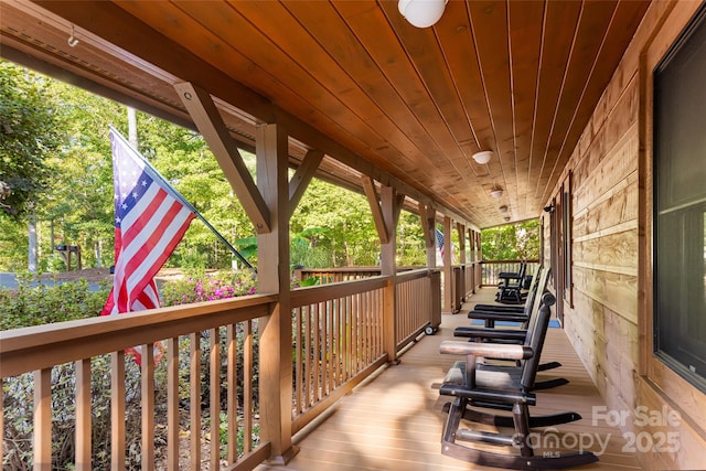 wooden terrace featuring a porch