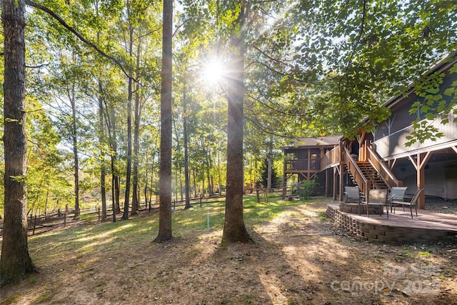 view of yard featuring a patio area and a wooden deck