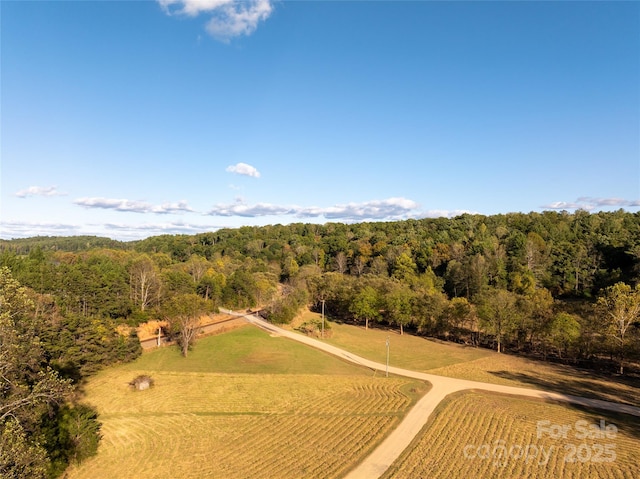 birds eye view of property featuring a rural view