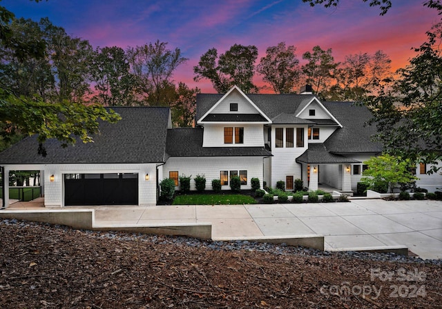 13702 Sage Thrasher Ln, Charlotte, NC 28278 - modern inspired farmhouse featuring a chimney, a shingled roof, driveway, and an attached garage
