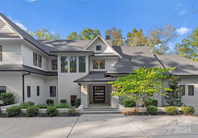 13702 Sage Thrasher Ln, Charlotte, NC 28278 - view of front of property with roof with shingles and a chimney