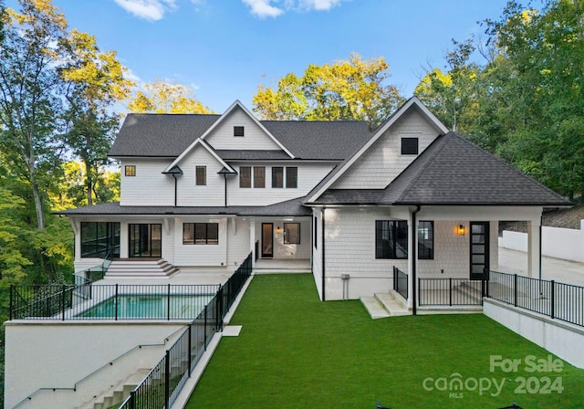 rear view of property featuring a yard