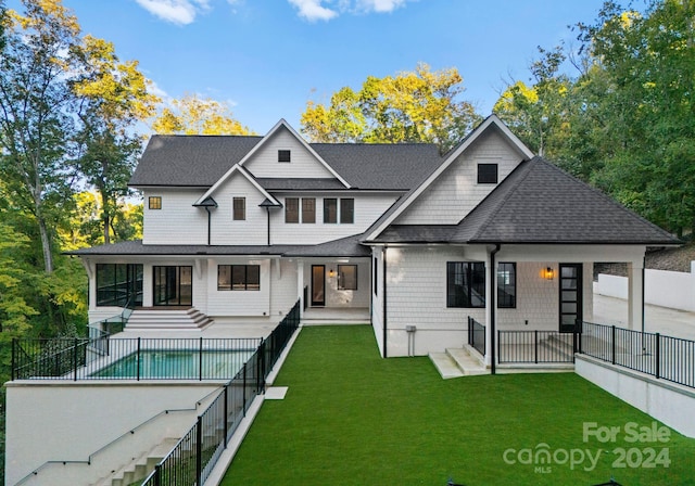 13702 Sage Thrasher Ln, Charlotte, NC 28278 - back of property featuring a patio area and roof with shingles