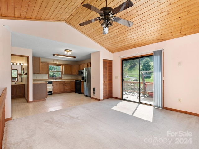 unfurnished living room with ceiling fan, wood ceiling, sink, light colored carpet, and vaulted ceiling