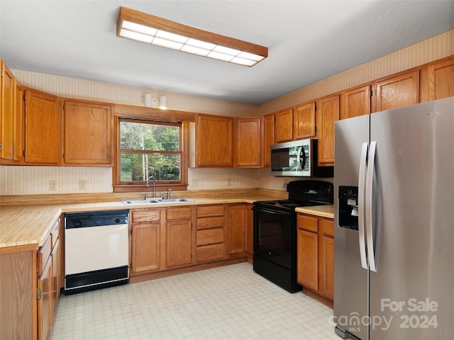 kitchen featuring appliances with stainless steel finishes and sink