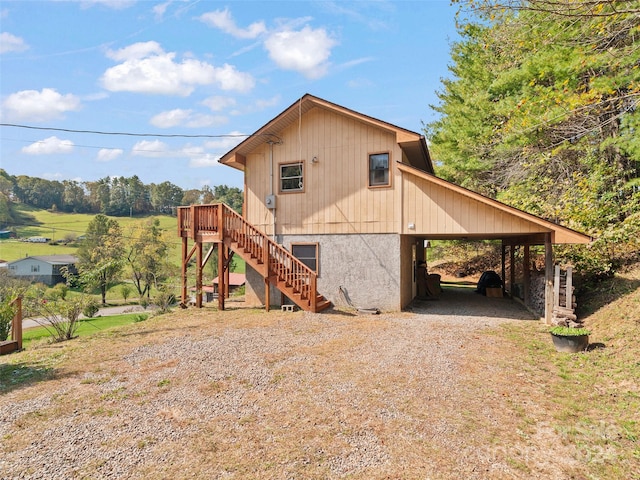 view of home's exterior featuring a carport