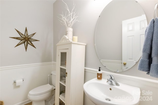 bathroom with toilet and sink