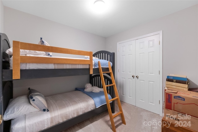 carpeted bedroom featuring a closet