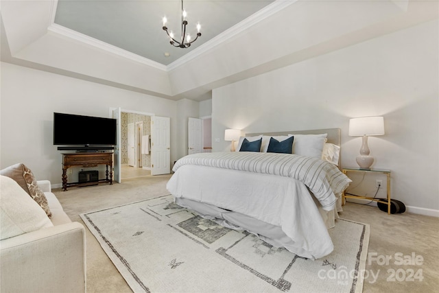 carpeted bedroom with crown molding, a tray ceiling, and an inviting chandelier