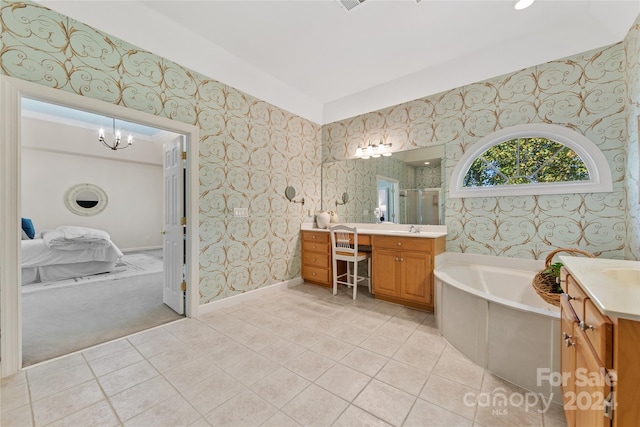 bathroom with vanity, a chandelier, plus walk in shower, and tile patterned flooring